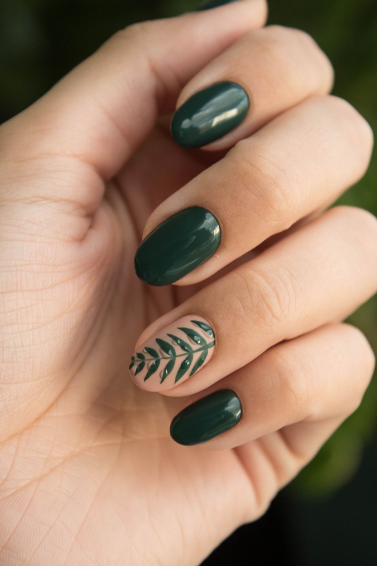 Green nail art manicure at a neighborhood nail studio